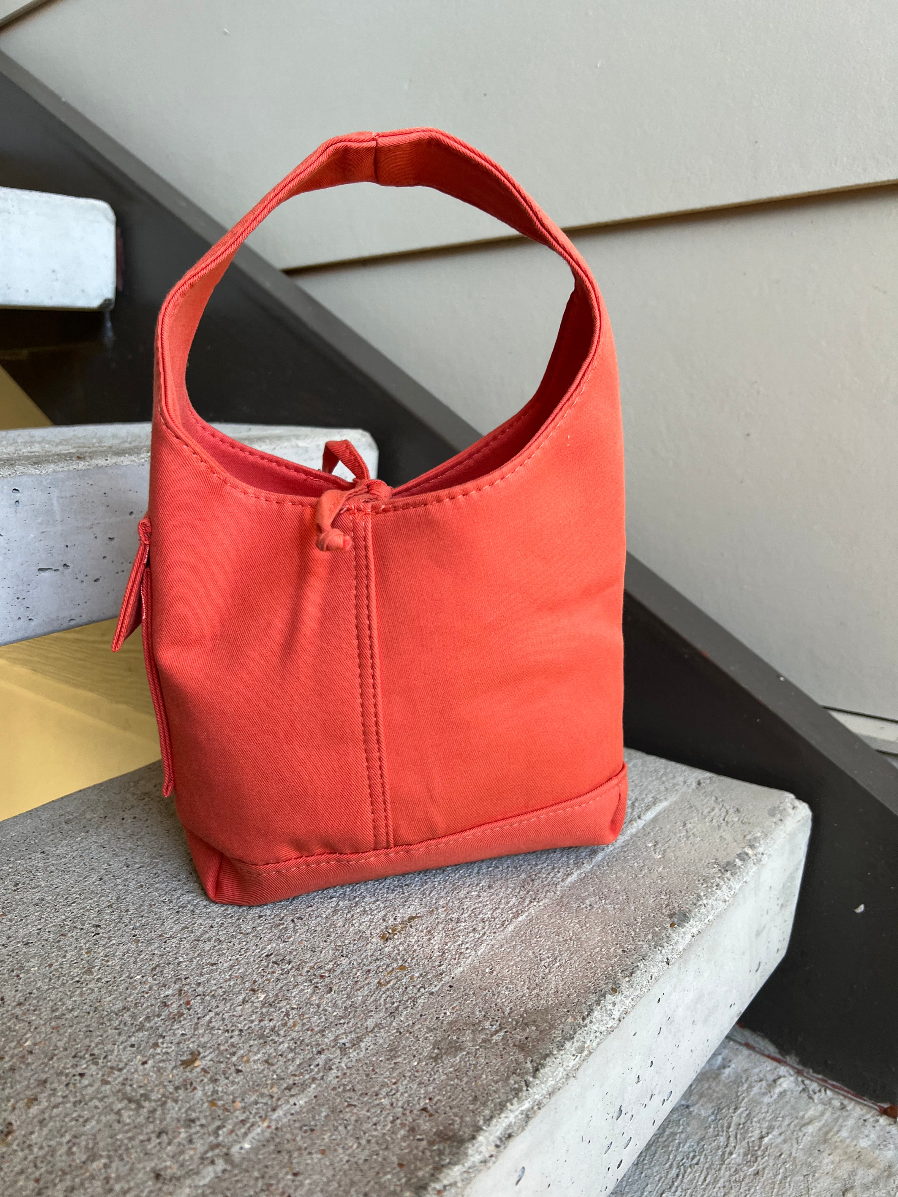 Orange one handle bag