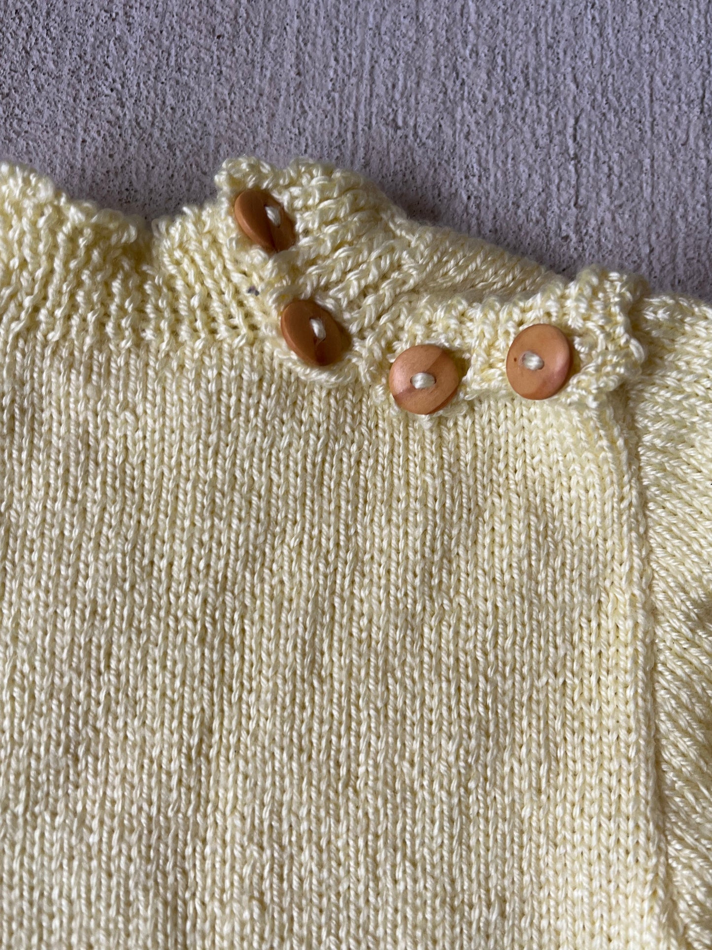 yellow button neck sweater