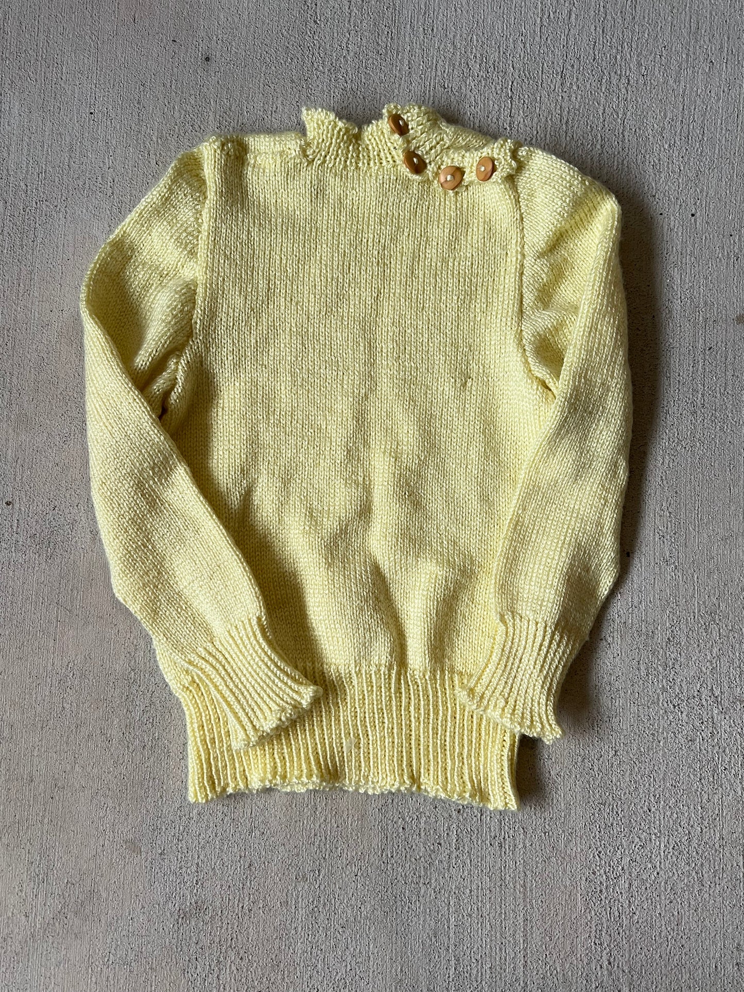 yellow button neck sweater